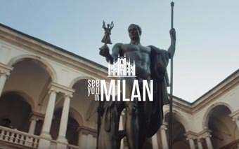 A statue stands in the courtyard of a historic Milan building with arches and columns. Overlaid text reads See you in Milan with a graphic of Milan’s cathedral above the words, hinting at a special LIDL event.