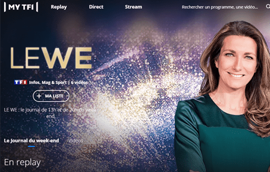 A woman with long brown hair smiles at the camera, standing in front of a sparkling gold and blue background, with LE WE and TF1 logos on the left—perfectly embodying the spirit of a lively lifestyle magazine or Weekend Journal.