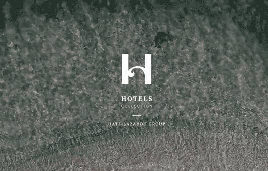 Logo for Hotels Collection by Hatzilazarou Group on a textured, greenish-gray background that resembles an aerial view of waves or sand. The large white H is centered above the company names.