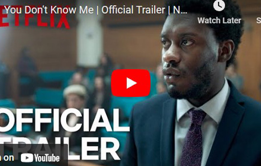 A man in a suit stands in a courtroom, looking serious. The text reads You Dont Know Me | Official Trailer | Netflix. The YouTube play button is visible, hinting at the suspenseful drama of You Dont Know Me.