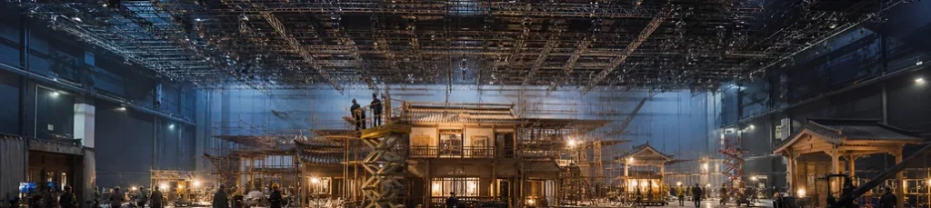 A large soundstage with a set under construction in China.