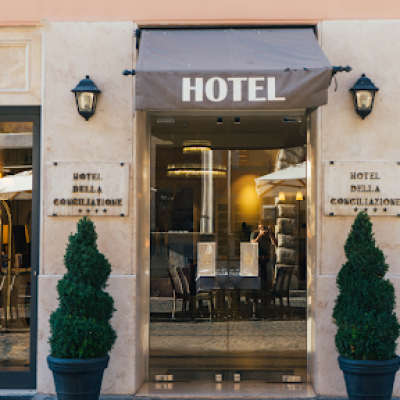 A hotel entrance with a glass door, perfect for accommodation and ideal for film crews needing seamless travel arrangements.