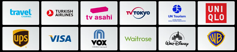 A grid of twelve company logos, including Travel Channel, Turkish Airlines, TV Asahi, TV Tokyo, UN Tourism, UNIQLO, UPS, VISA, VOX, Waitrose, Walt Disney, and Warner Bros.